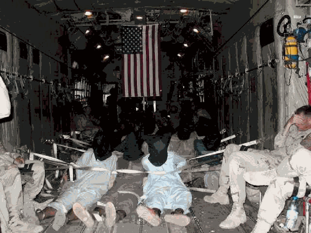 Suspects being flown in to Guantanamo. Suspects being flown in to Guantanamo.